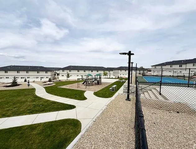 Community amenities featuring a playground, tennis court, and walking paths