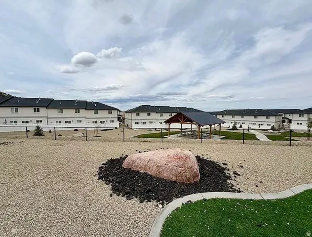 Community gathering area with a central gazebo, paved walkways, and landscaped green spaces