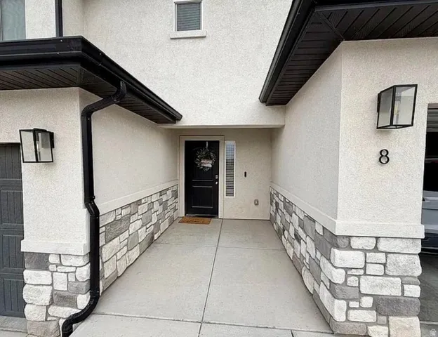 Stucco exterior with stone veneer accents