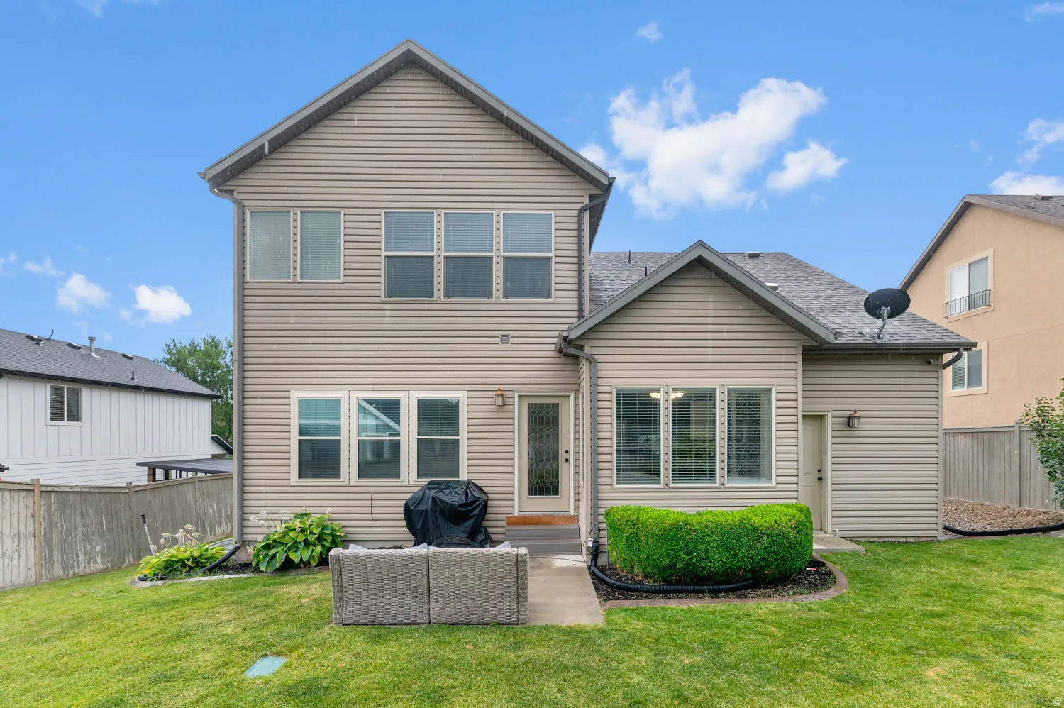 Multi-level exterior with horizontal siding and a gabled roofline
