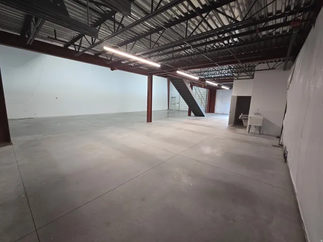 Expansive open concept interior featuring polished concrete flooring