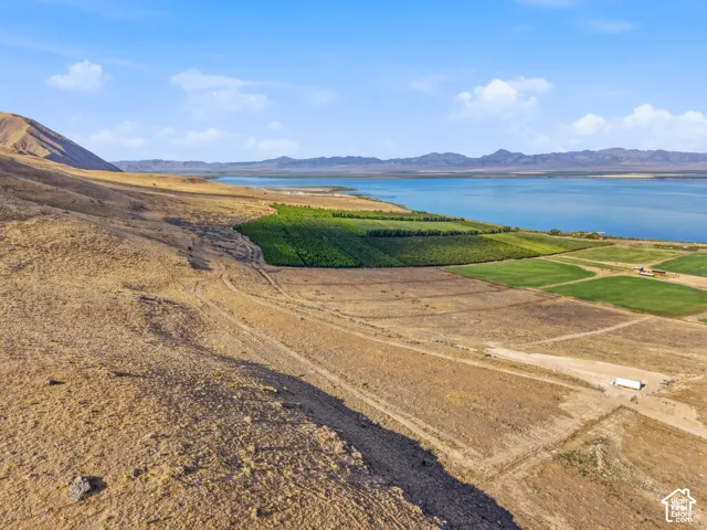 Expansive raw land featuring varied topography, including a prominent hill and flat areas