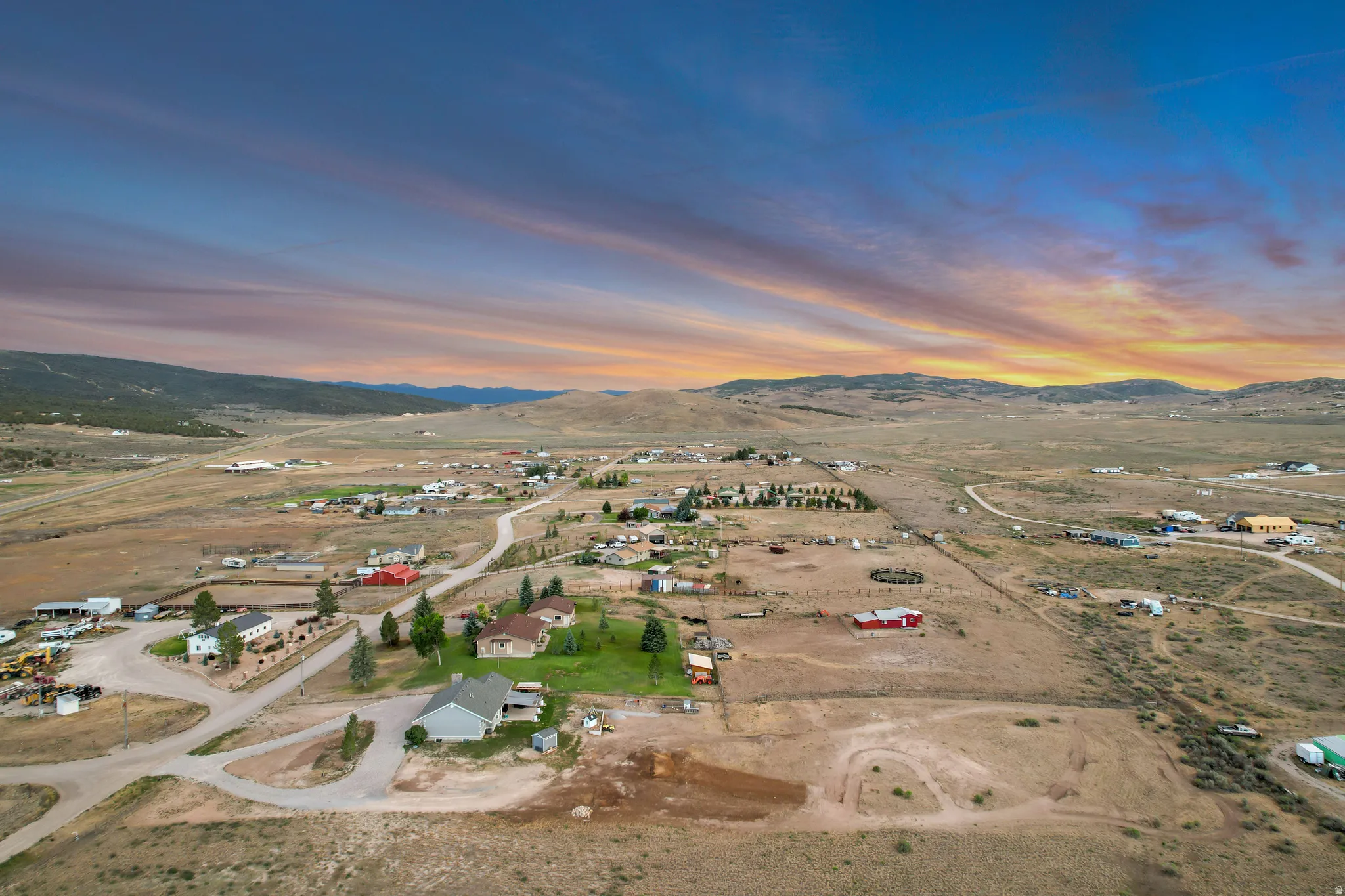 Expansive rural landscape featuring scattered residences and extensive open land