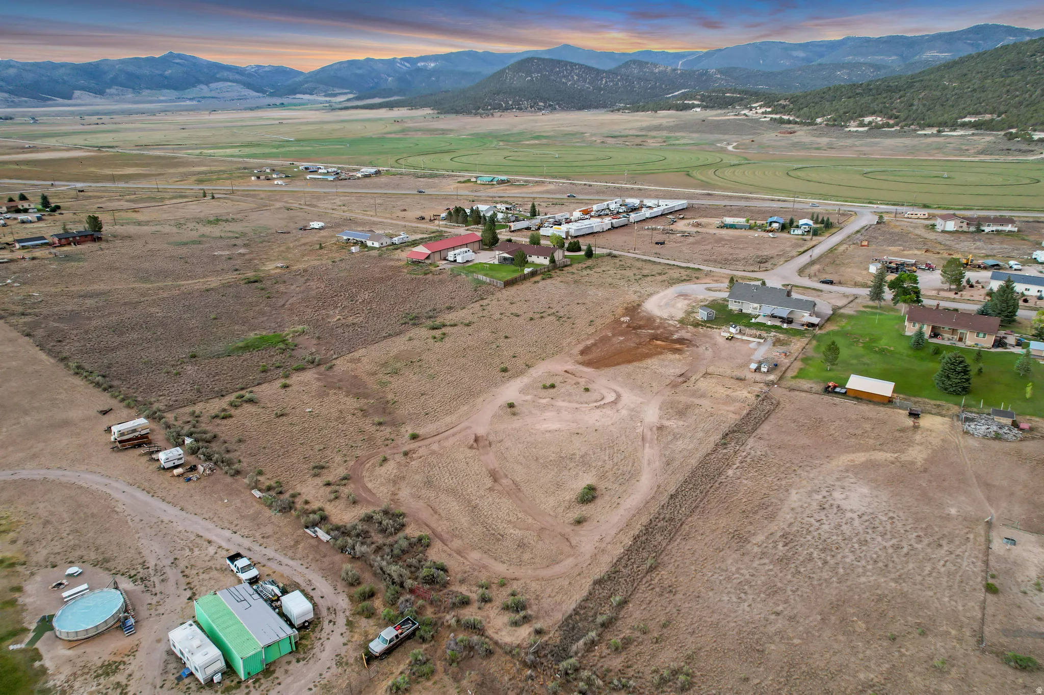 Expansive land parcel featuring natural terrain and distant mountain ranges