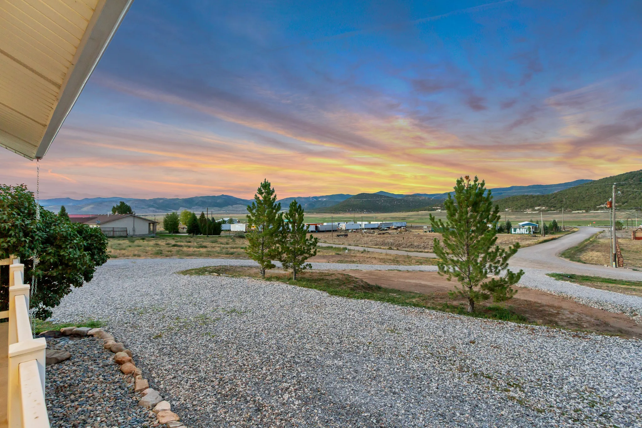 Expansive gravel driveway with a curving path