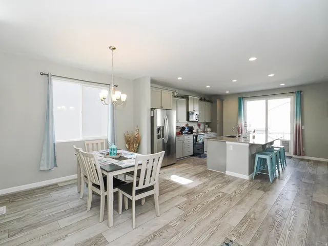 Open-concept living space with wood-finish flooring