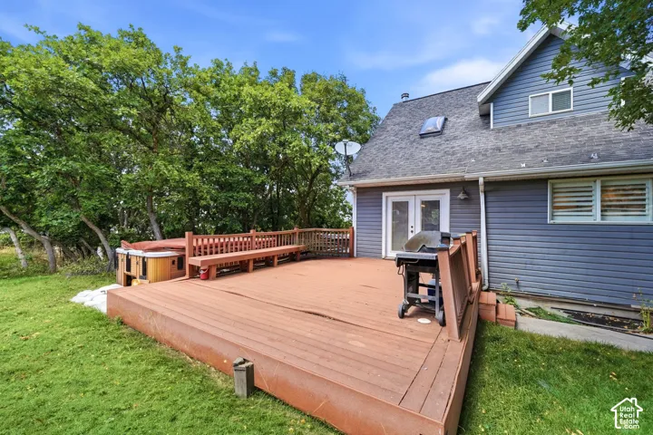 Expansive wood-finish deck with integrated seating and railing