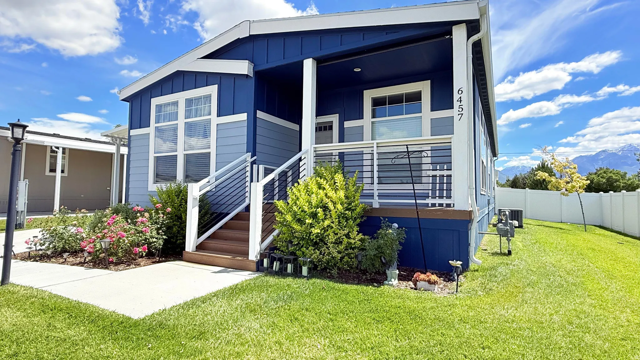 Contemporary exterior showcasing blue and light blue siding with white trim