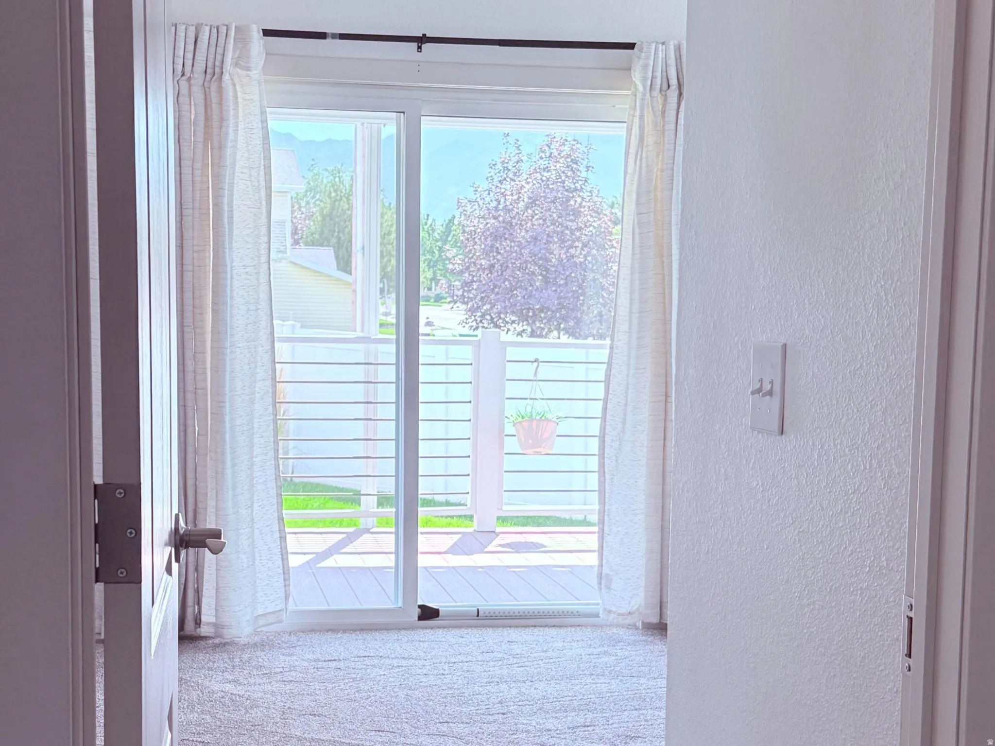 Sliding door to back deck and yard through Primary bedroom.