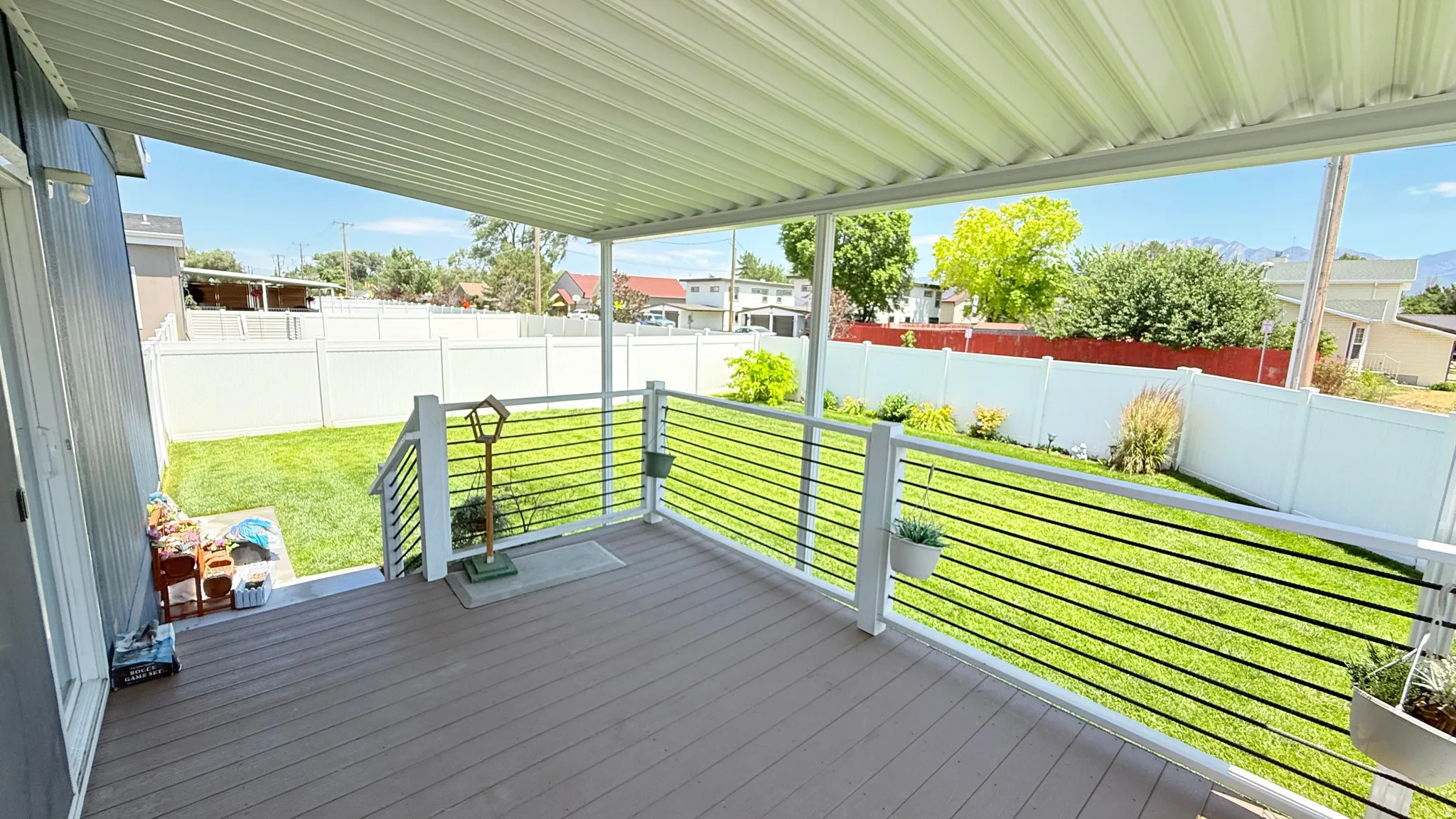 Covered deck and large backyard.
