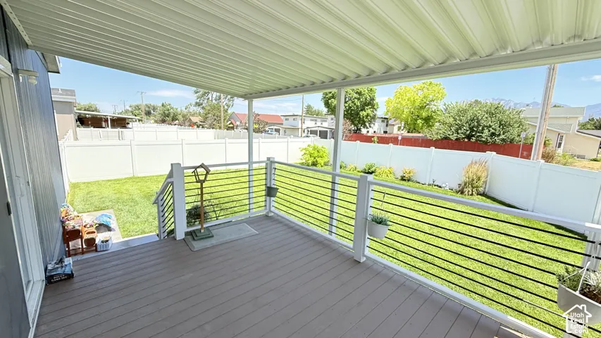 Covered deck and large backyard.
