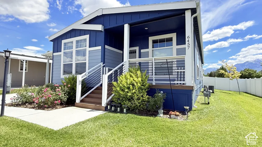 Contemporary exterior showcasing blue and light blue siding with white trim