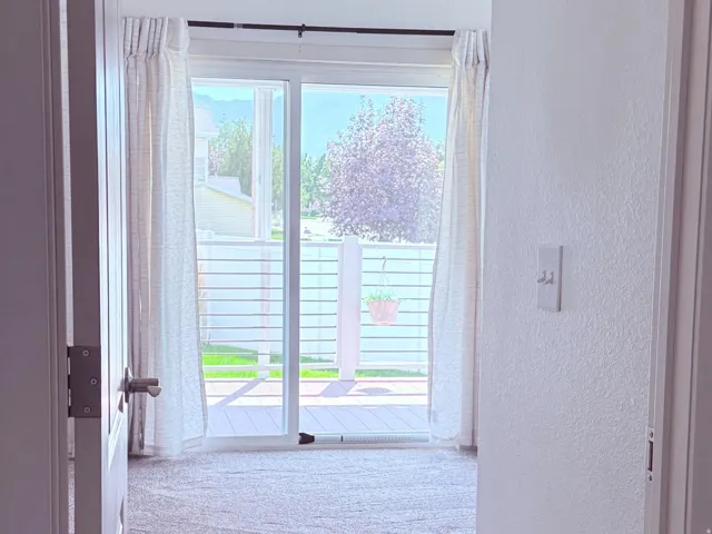 Sliding door to back deck and yard through Primary bedroom.
