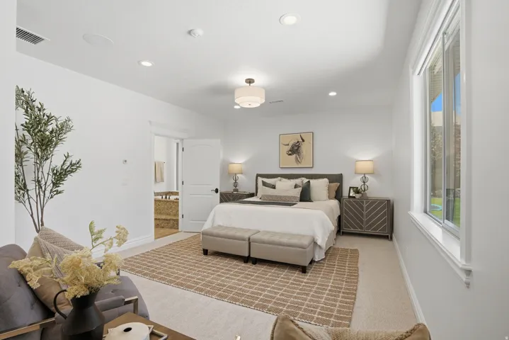 Spacious room featuring recessed lighting, a ceiling fan with light fixture, and a large window with white trim