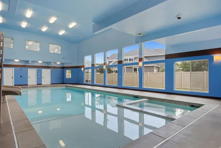 Indoor swimming pool with integrated spa and pool slide