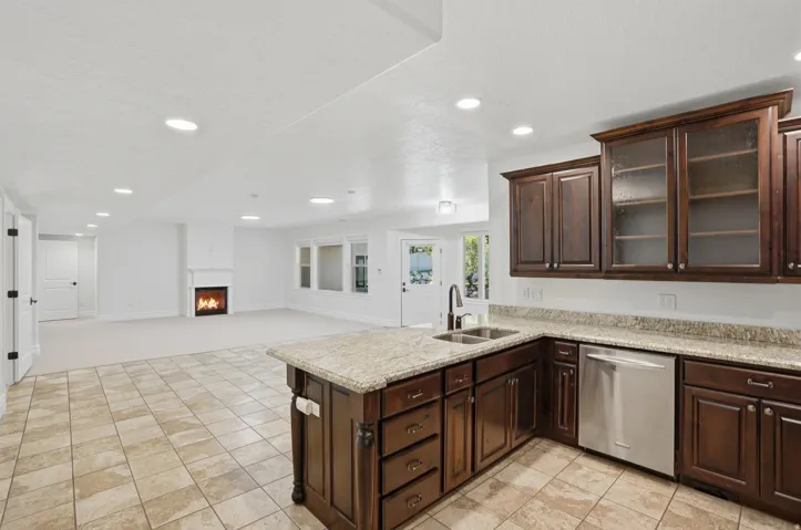 Kitchen island with granite-finish countertop and double basin sink