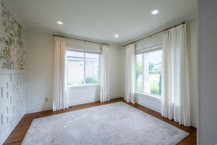 Bright interior space featuring wood-finish flooring, recessed lighting, and white trim
