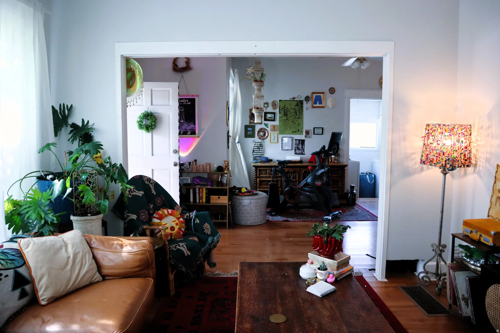 Bright interior space featuring light-colored walls and wood-finish flooring