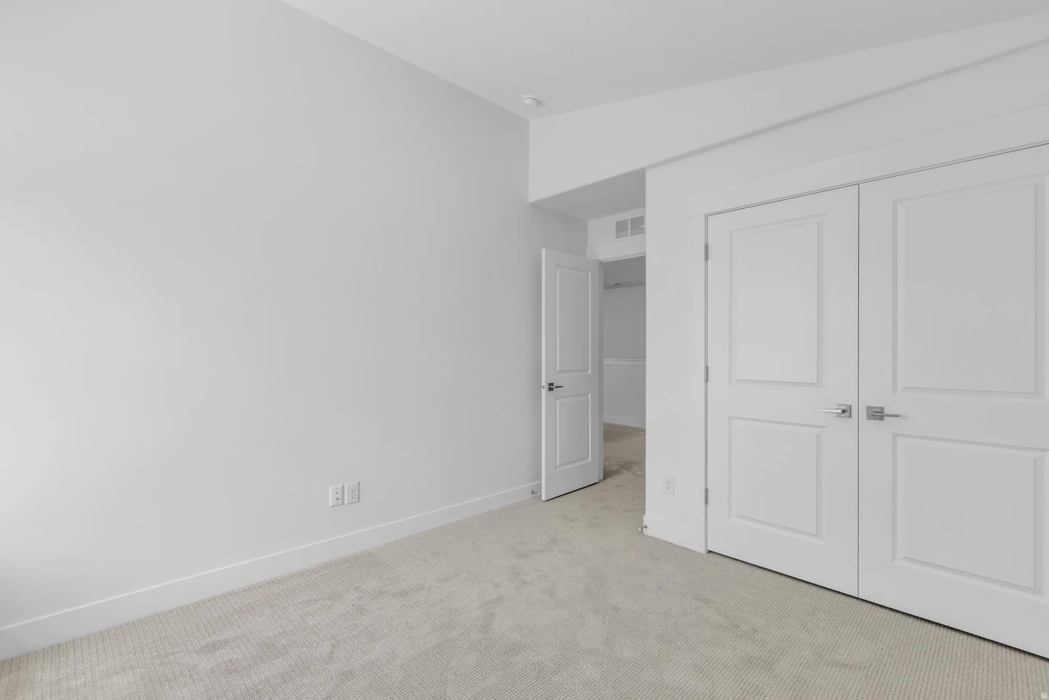 Vaulted bedroom #3with double-door closet.