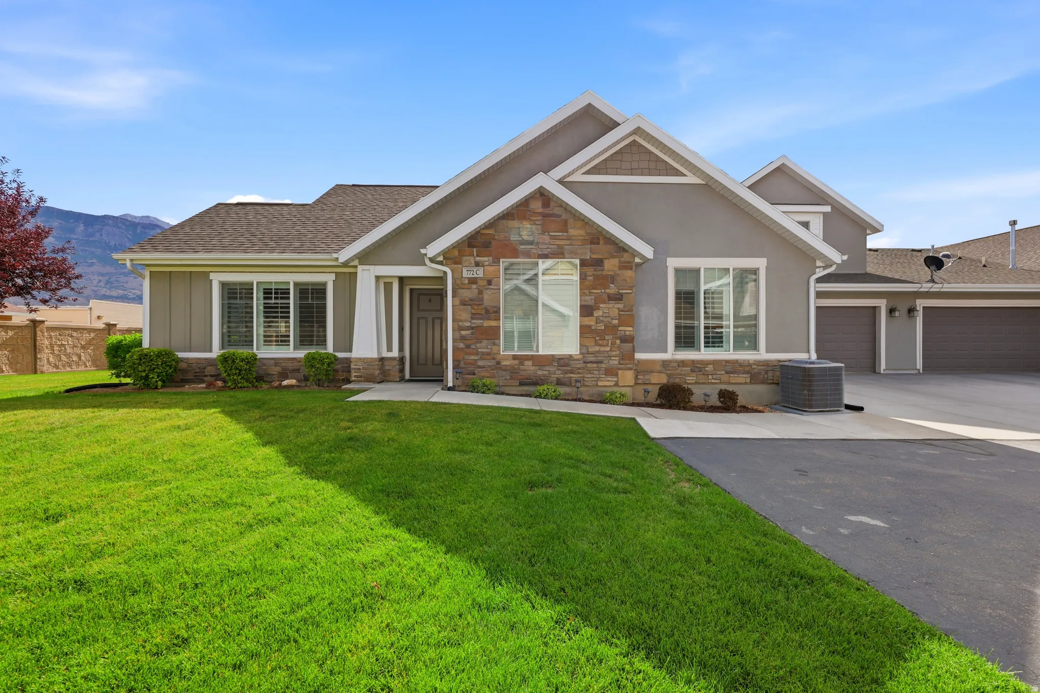 Exterior facade featuring stone and stucco finishes