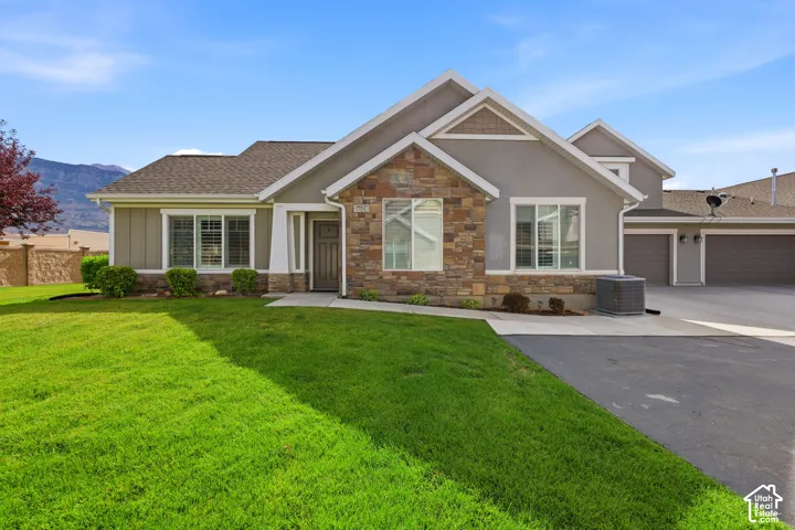 Exterior facade featuring stone and stucco finishes