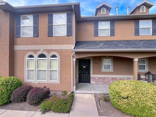 Classic, maintenance-free exterior featuring clean stucco with just the right blend of stone and an inviting front porch.