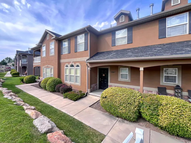 Classic, maintenance-free exterior featuring clean stucco with just the right blend of stone and an inviting front porch.