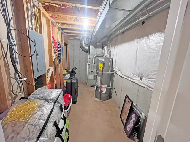Dedicated utility room featuring additional storage options