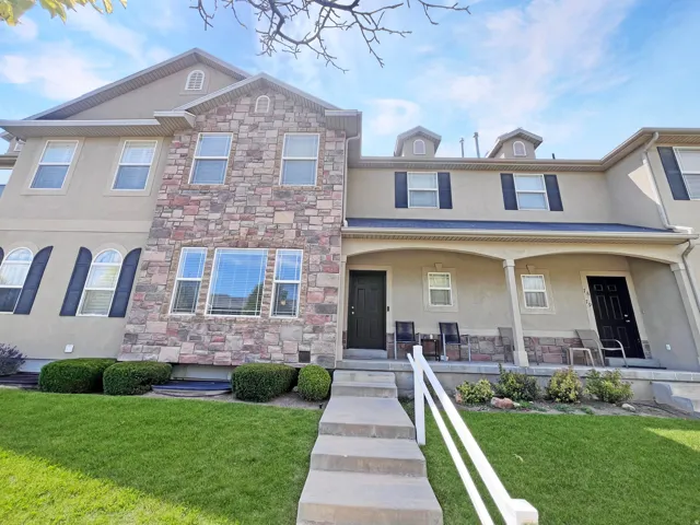 Classic, maintenance-free exterior featuring clean stucco with just the right blend of stone and an inviting front porch.