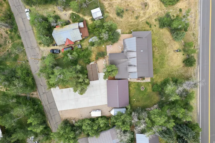 Expansive property featuring multiple structures and ample paved parking
