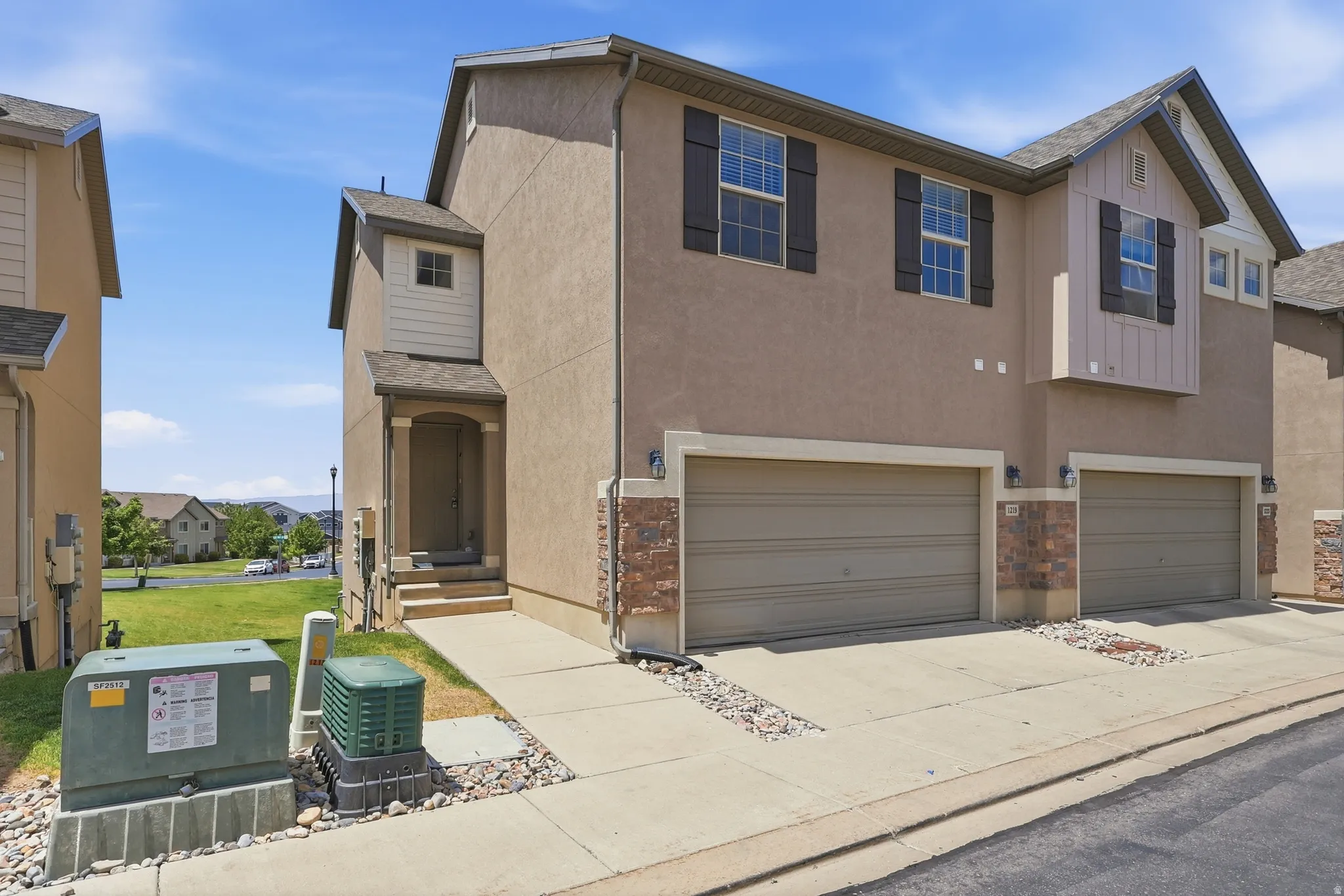 Exterior stucco finish with stone facade accents