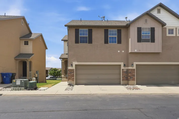 Contemporary stucco exterior with contrasting board and batten accents