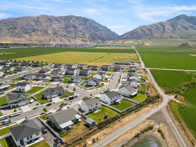 Aerial perspective showcasing a developed residential neighborhood with structured streets and individual properties