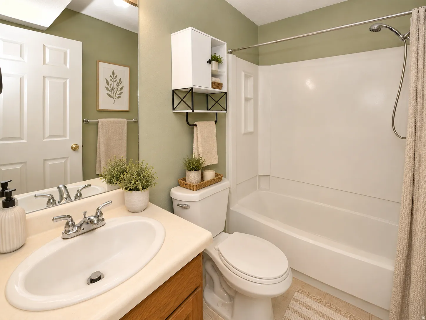 Bathroom featuring a white vanity with an integrated sink, chrome faucet, and wood-finish cabinetry