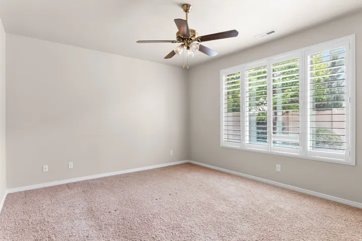 Neutral wall paint and plush carpet flooring throughout
