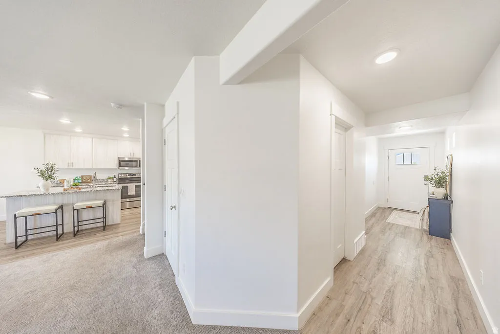View to front door hallway and toward kitchen.