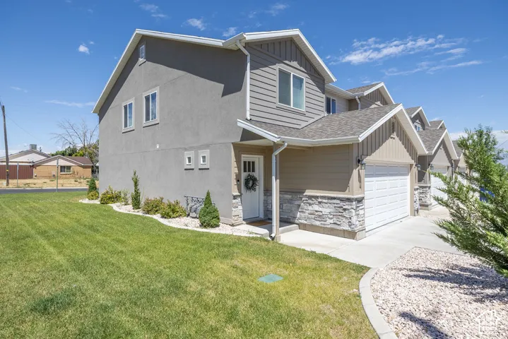 Gray stucco and siding exterior with white trim