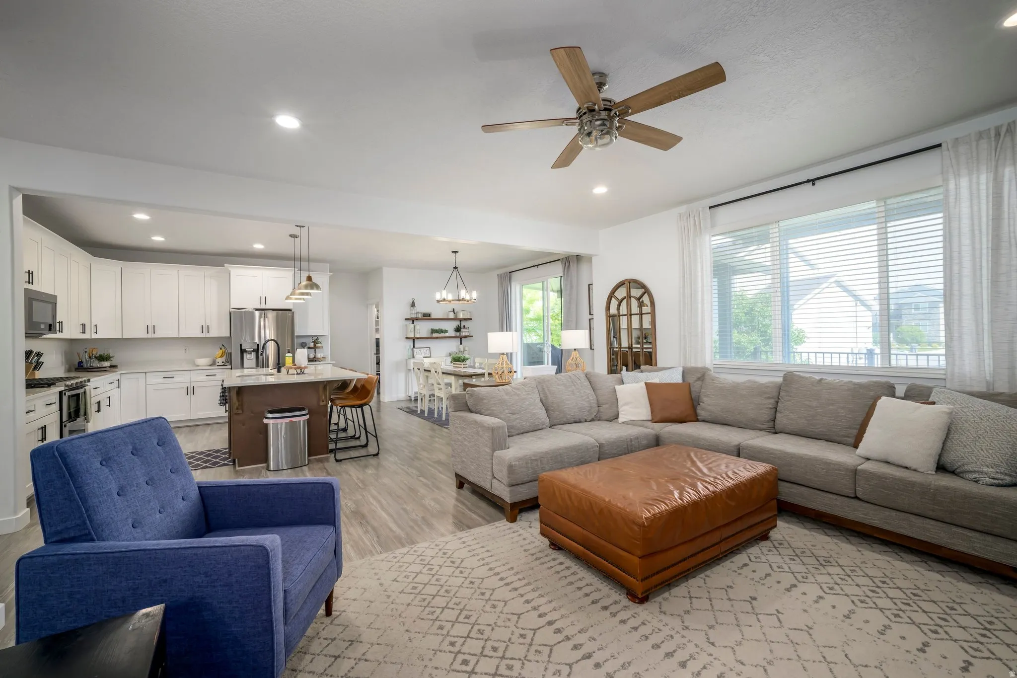 Open-concept living space featuring wood-finish flooring