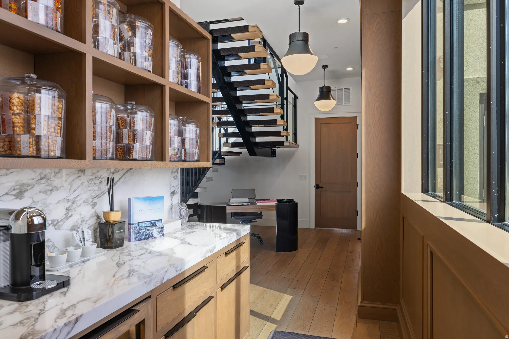 Custom built-in cabinetry with marble-look countertops and integrated shelving