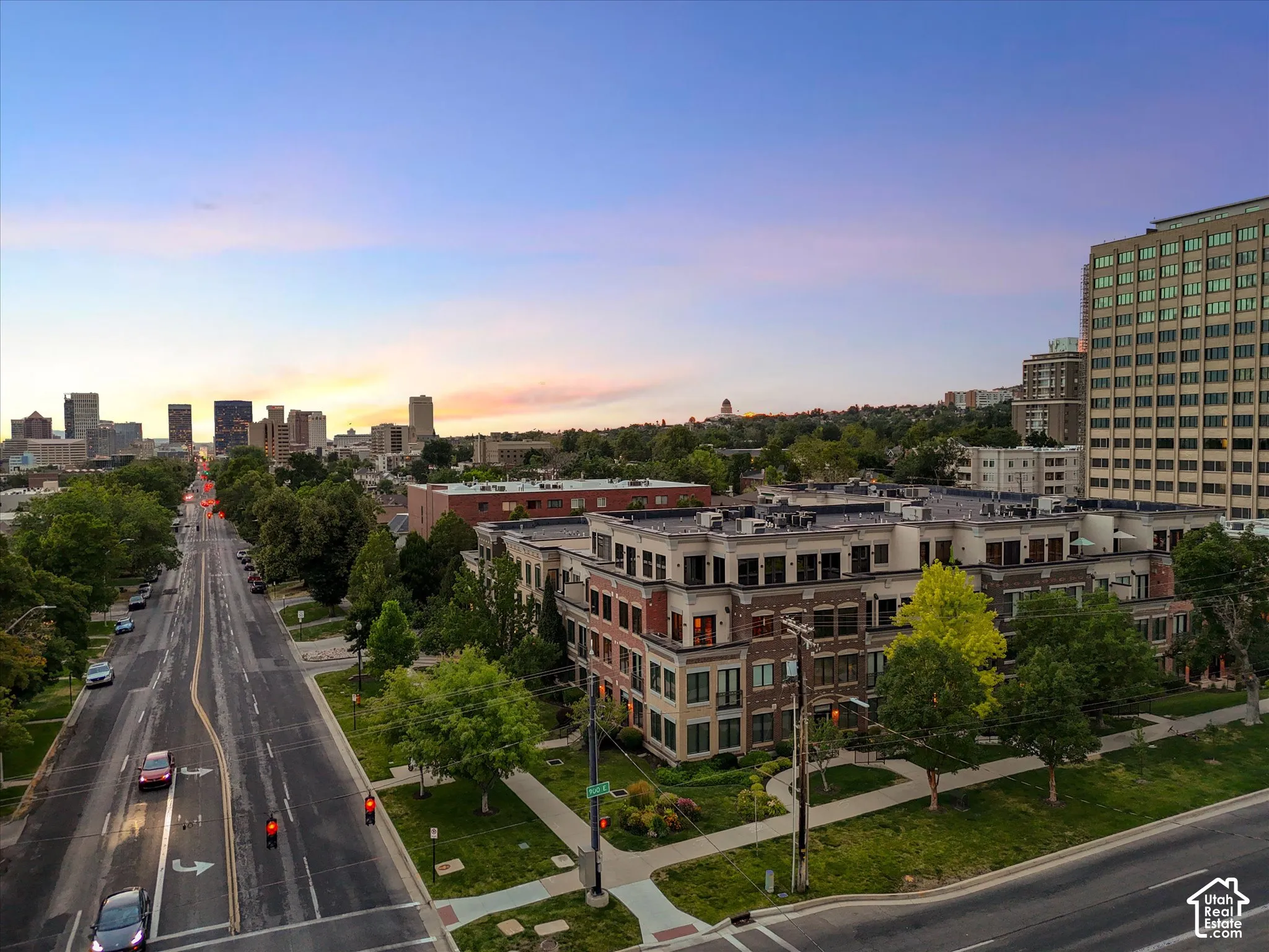 Mixed-use residential and commercial complex featuring brick and light-toned facade elements