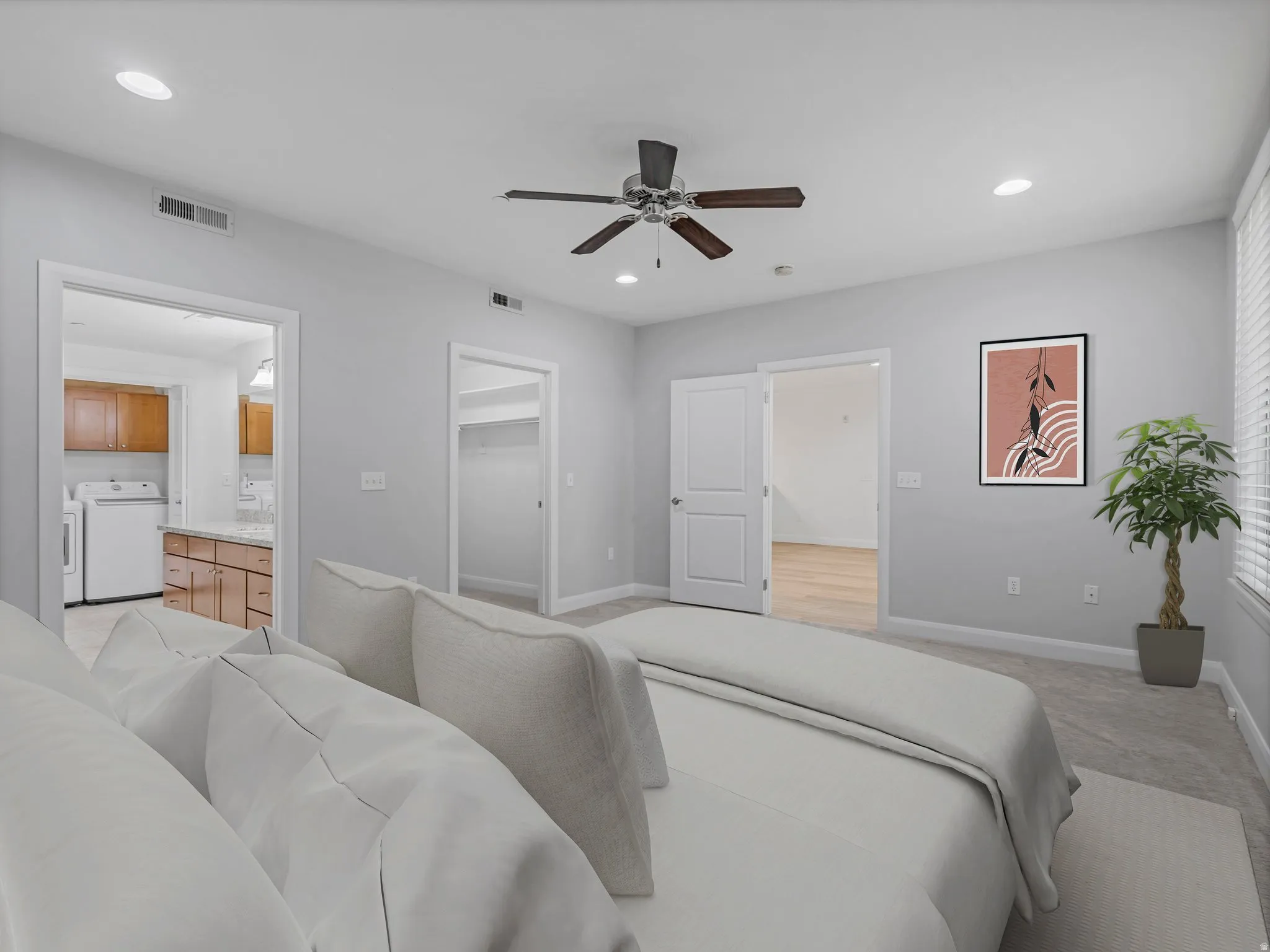 Carpeted bedroom featuring a ceiling fan with light fixture, recessed lighting, and bright natural light from the window