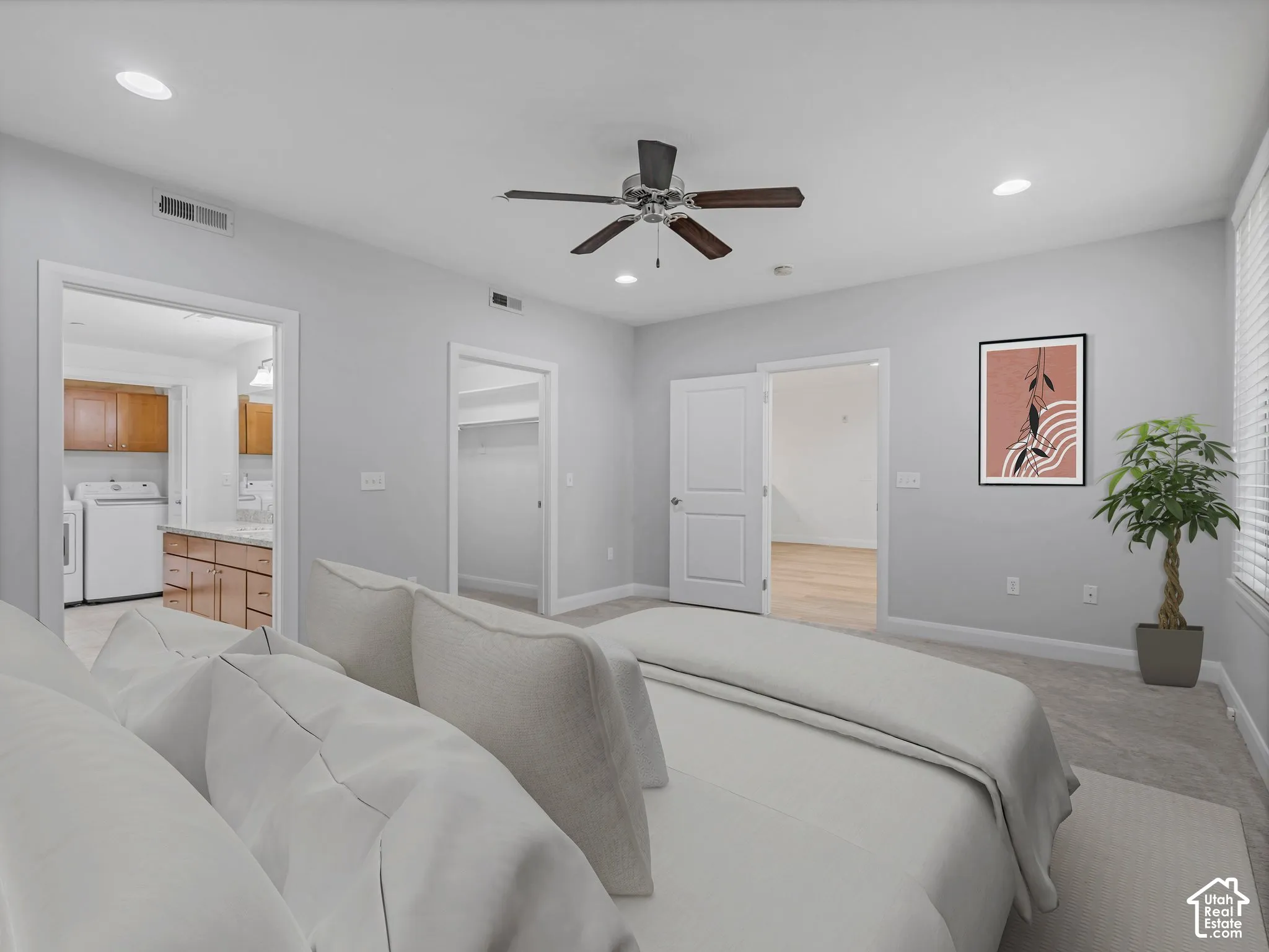 Carpeted bedroom featuring a ceiling fan with light fixture, recessed lighting, and bright natural light from the window