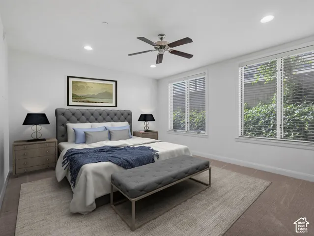 Bedroom featuring recessed lighting, a ceiling fan, and two windows with blinds