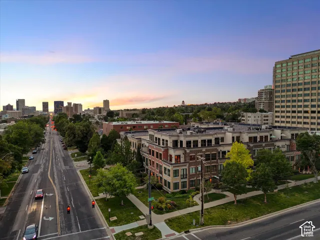 Mixed-use residential and commercial complex featuring brick and light-toned facade elements