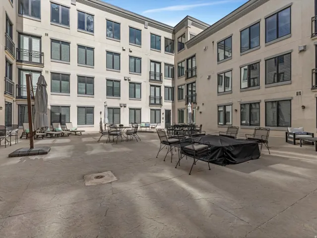 Expansive courtyard featuring stamped concrete flooring