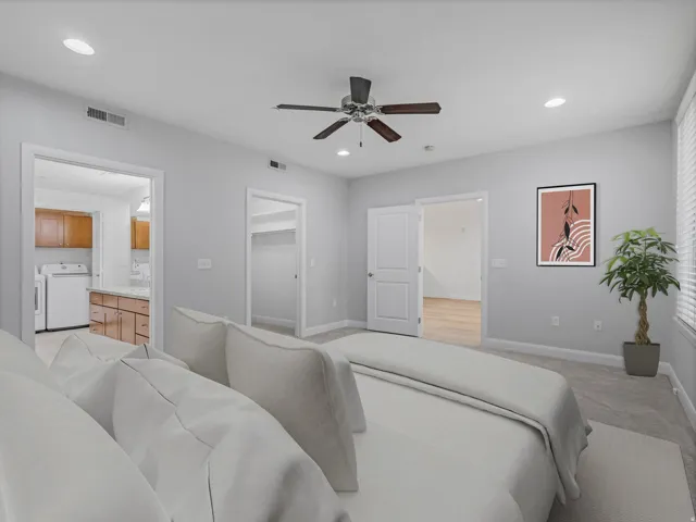 Carpeted bedroom featuring a ceiling fan with light fixture, recessed lighting, and bright natural light from the window