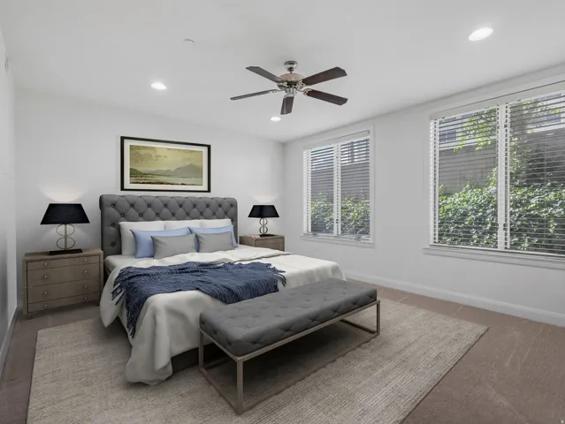 Bedroom featuring recessed lighting, a ceiling fan, and two windows with blinds