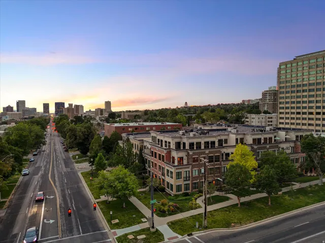 Mixed-use residential and commercial complex featuring brick and light-toned facade elements