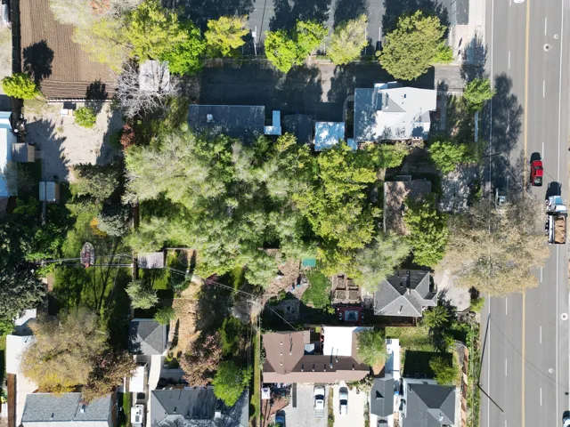 Aerial perspective showcasing a residential property with established trees