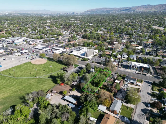 Expansive parcel featuring mature trees, a clear boundary, and proximity to established neighborhood infrastructure
